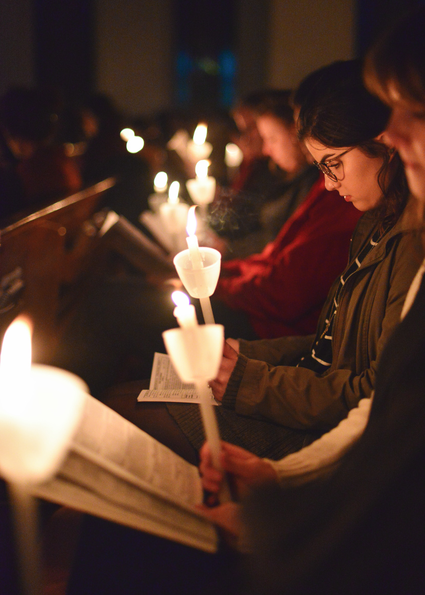 Girls with candles reading Girls with candles reading