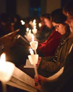 Girls with candles reading