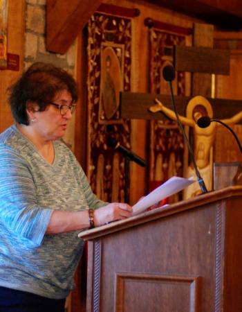 Woman at the chanting stand