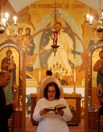 Woman reading the epistle in church